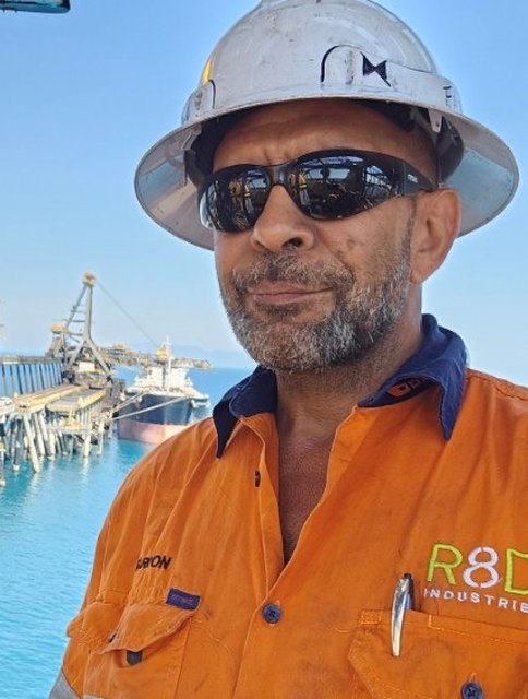 R8D team member at an industrial port facility